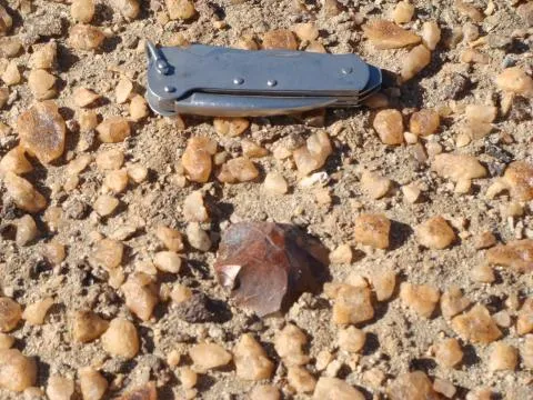 Artefact in situ with scale © Photo: J. Kinahan